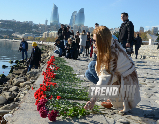 Baku residents bringing flowers to Seaside Boulevard to honor missing oil workers.  Azerbaijan, Dec.07, 2015